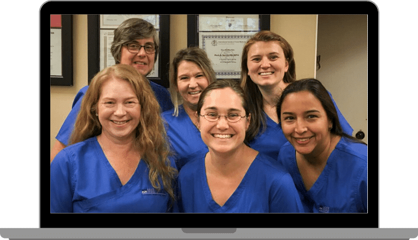 The staff of MedFirst posing and smiling together